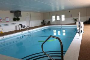 a large swimming pool in a building at Sunbird Cape Cod Annex in West Yarmouth