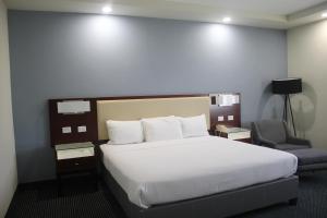 Postel nebo postele na pokoji v ubytování Best Western Santorin
