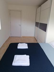 Säng eller sängar i ett rum på Apartment Novi Central