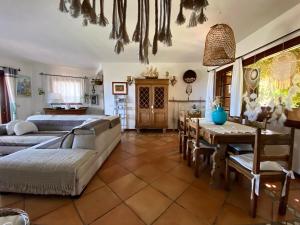 a living room with a couch and a table at Villa Acchiappasogni in Porto San Paolo