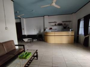 a living room with a couch and a table at OYO 92762 Wisma Pundu Syariah 