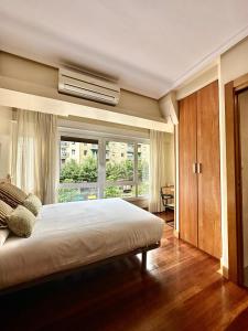 A bed or beds in a room at Pension Anoeta