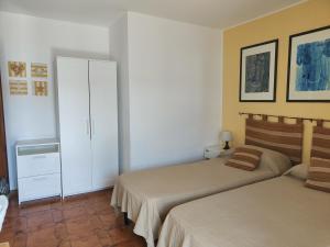 Posteľ alebo postele v izbe v ubytovaní Casa Parco Aranci