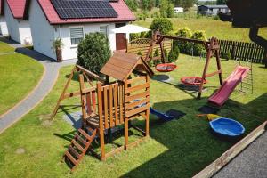 an aerial view of a playground in a yard at Domki Oliwia in Łeba