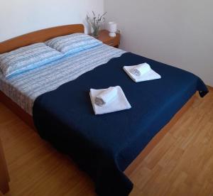 Postel nebo postele na pokoji v ubytování Lucija