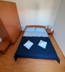 Postel nebo postele na pokoji v ubytování Lucija