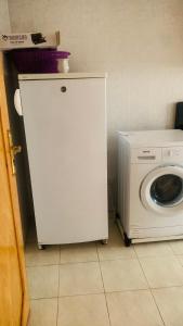 a washing machine and a washer in a room at Cartier El MANAR El jadida CITY in El Jadida