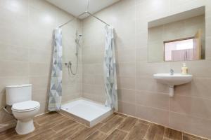 a bathroom with a toilet and a sink at CAMP NOU & FiRA BUSINESS LOFTS in Barcelona