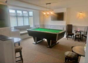 a living room with a pool table in it at The Graph’s Gaff in Aycliffe