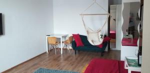 a living room with a chair and a table at Private room at Ceausescu's place in Old City Unirii Square in Bucharest