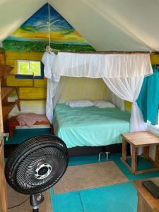 a bedroom with a bed in a tent at Princesa del Mar in Playa Blanca