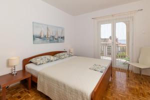 Postel nebo postele na pokoji v ubytování Apartments Nada