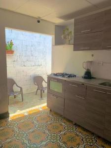 a kitchen with a sink and a counter top at Casa Cairo in Cartagena de Indias