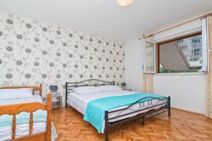 Posteľ alebo postele v izbe v ubytovaní Cakic apartmani