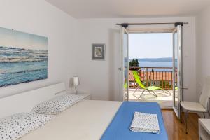 Postel nebo postele na pokoji v ubytování Apartments Nada