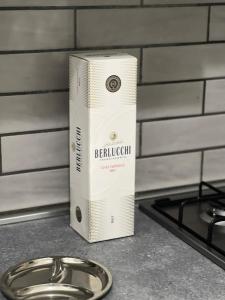 a box sitting on a counter next to a stove at inside Sedil Dominova House in Sorrento