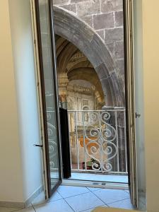 an open door to a building with a window at inside Sedil Dominova House in Sorrento