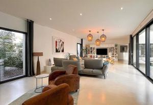 Posezení v ubytování Villa d'architecte Cocoon 200m à pied de la plage