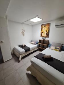 Ένα ή περισσότερα κρεβάτια σε δωμάτιο στο Au Petit Maracudja plage Anse a L'ane