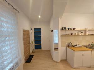 a kitchen with a sink and a counter top at Kawalerka w centrum Sopotu in Sopot