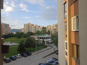 a view of a city with cars parked on a street at Lux Apartment Sarajevo in Sarajevo