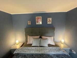 Rúm í herbergi á Duplex Oasis Ada