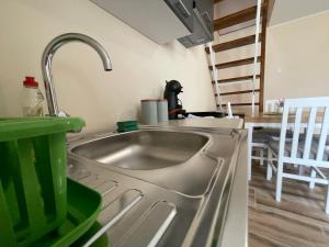 Kuchyň nebo kuchyňský kout v ubytování Duplex Oasis Ada + 37 fotografií