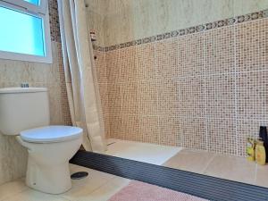 a bathroom with a toilet and a shower at Las Teresitas Apartment in San Andrés +37 photos