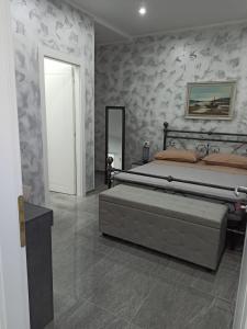 a bedroom with a large bed and a mirror at Le Sirene in Brindisi