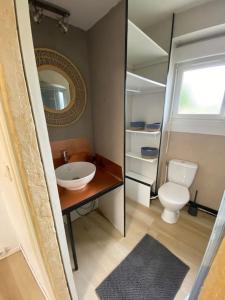 a bathroom with a sink and a toilet at Maison de Charme 4 chambres in Les Moutiers-en-Cinglais