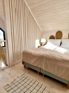 Säng eller sängar i ett rum på Lulu Holiday Resort