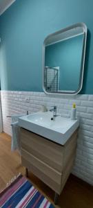 a bathroom with a sink and a mirror at Ti Racconto di un Sogno Rooms - Cielo & Terra in Chianciano Terme