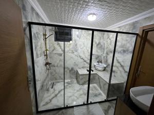 a bathroom with a marble shower with a sink at MARİPOSA LUXURY HOUSE in Ayder Yaylasi