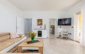 a living room with a couch and a table at Apartment Jela in Fažana