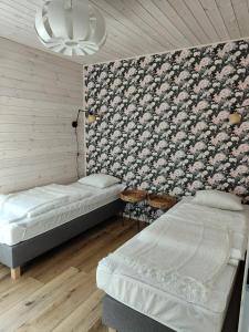 Postel nebo postele na pokoji v ubytování Morska Szyszka & Leśne SPA