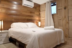 Rúm í herbergi á Hotel Boutique Antukenu