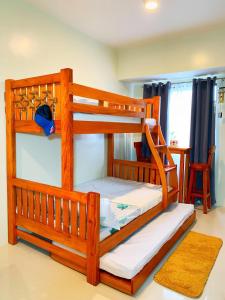 a couple of bunk beds in a room at Cozynest Condotel Baguio in Baguio
