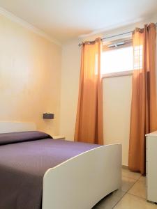 Кровать или кровати в номере Villa Terrazza sul Golfo