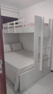 a couple of bunk beds in a room at Nannai Residence Flat in Porto De Galinhas