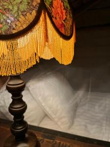 a close up of a table with a lamp at Annexet Orrabackens in Järvsö