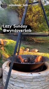 a dog is cooking in a fire pit at Wyndover Mountain Retreat in Beechmont