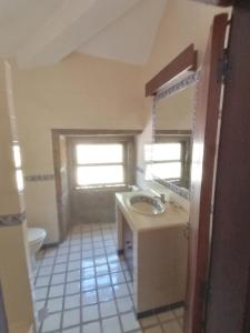 a bathroom with a sink and a toilet at Casa das Feitorias Douro Valley in Baião