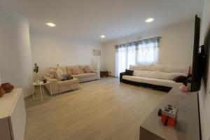 a large living room with two couches and a couch at Finca Artiles in Las Palmas de Gran Canaria