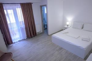Postel nebo postele na pokoji v ubytování Vila RD