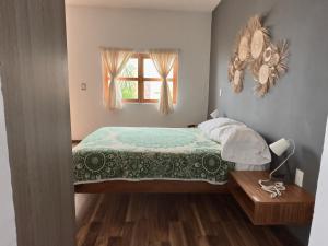 Llit o llits en una habitació de Casa San Pancho Centro Mágico