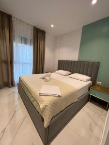 Ένα ή περισσότερα κρεβάτια σε δωμάτιο στο Mumbas Apartment 1