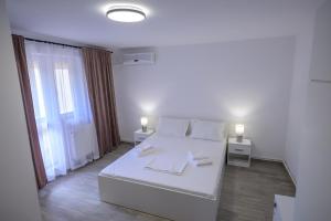 Postel nebo postele na pokoji v ubytování Vila RD