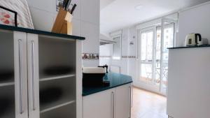 Η κουζίνα ή μικρή κουζίνα στο Céntrica y amplia Vivienda Turística con wifi +25 φωτογραφίες