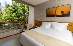 Postel nebo postele na pokoji v ubytování Flor de Lis Exclusive Hotel