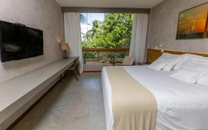 Postel nebo postele na pokoji v ubytování Flor de Lis Exclusive Hotel